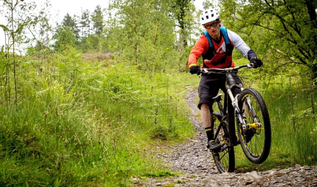 Cyclist mastering bike handling skills for long-distance rides on various terrains.